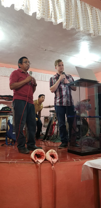 Zach ministering in a church