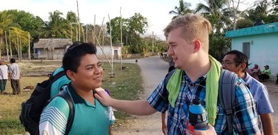Zach connecting with a man during ministry outreach